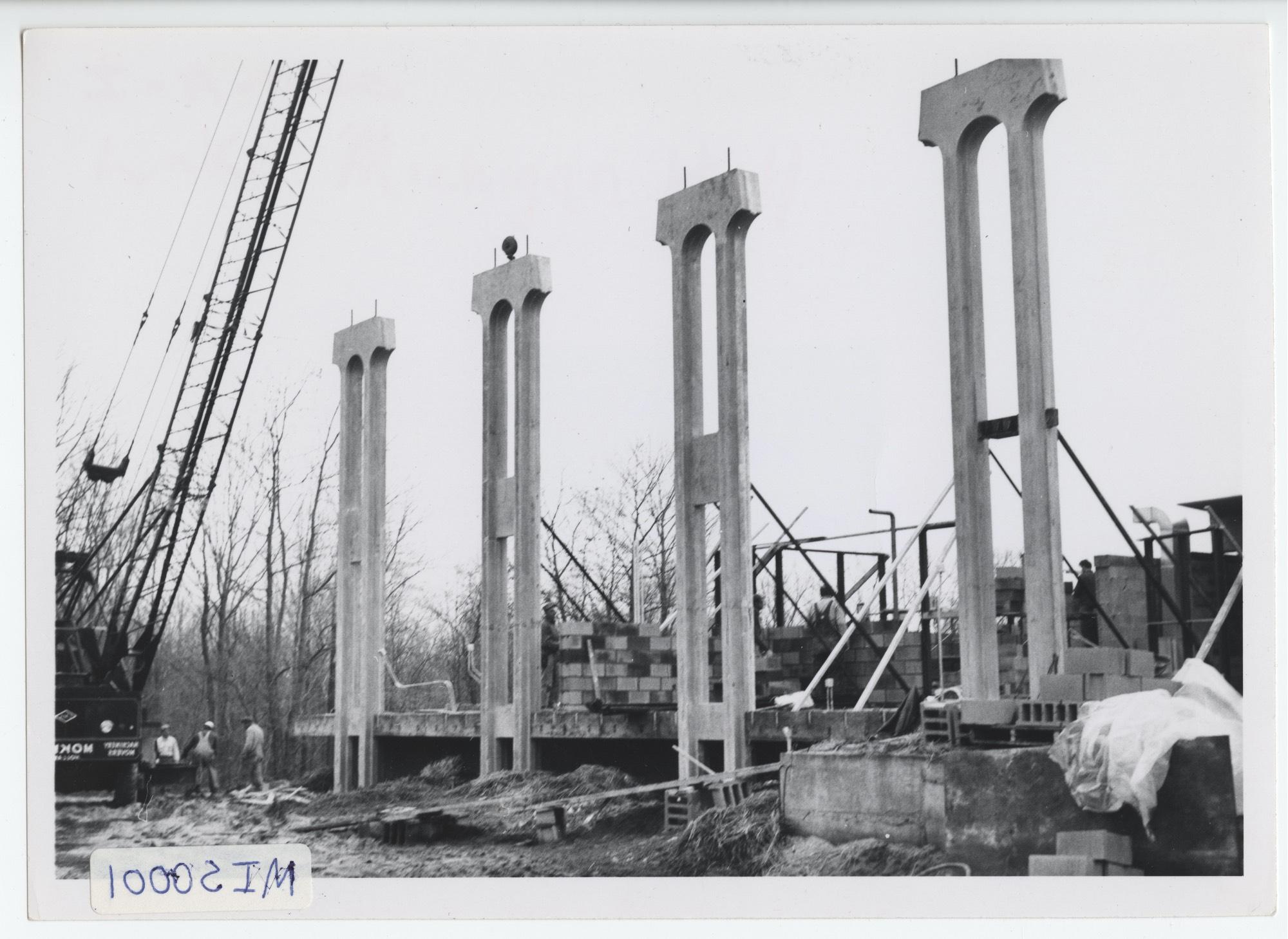 Lake Michigan Hall under construction. Precast 'trees' are hoisted into place as the walls go up for the first academic building on the Allendale campus.